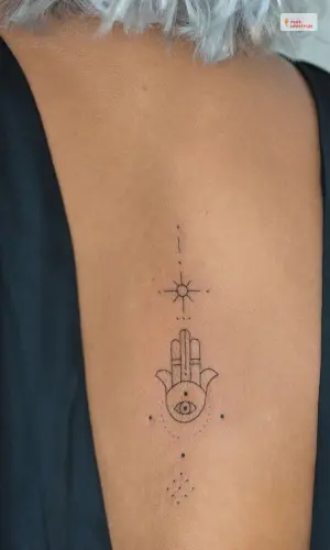 Hamsa Spine Tattoo